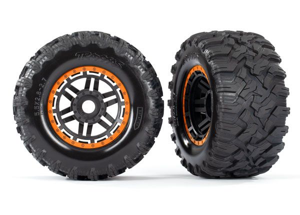 Traxxas Tires & wheels, assembled, glued (black, orange beadlock style wheels, Maxx MT tires, foam inserts) (2) (17mm splined) (TSM rated)